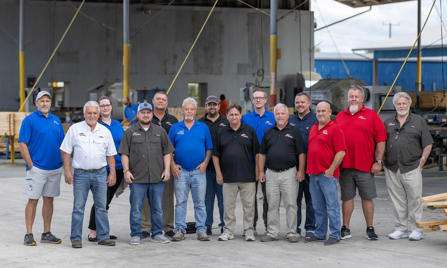 A photo of the DJ Trusses Unlimited team out in the lumber yard.